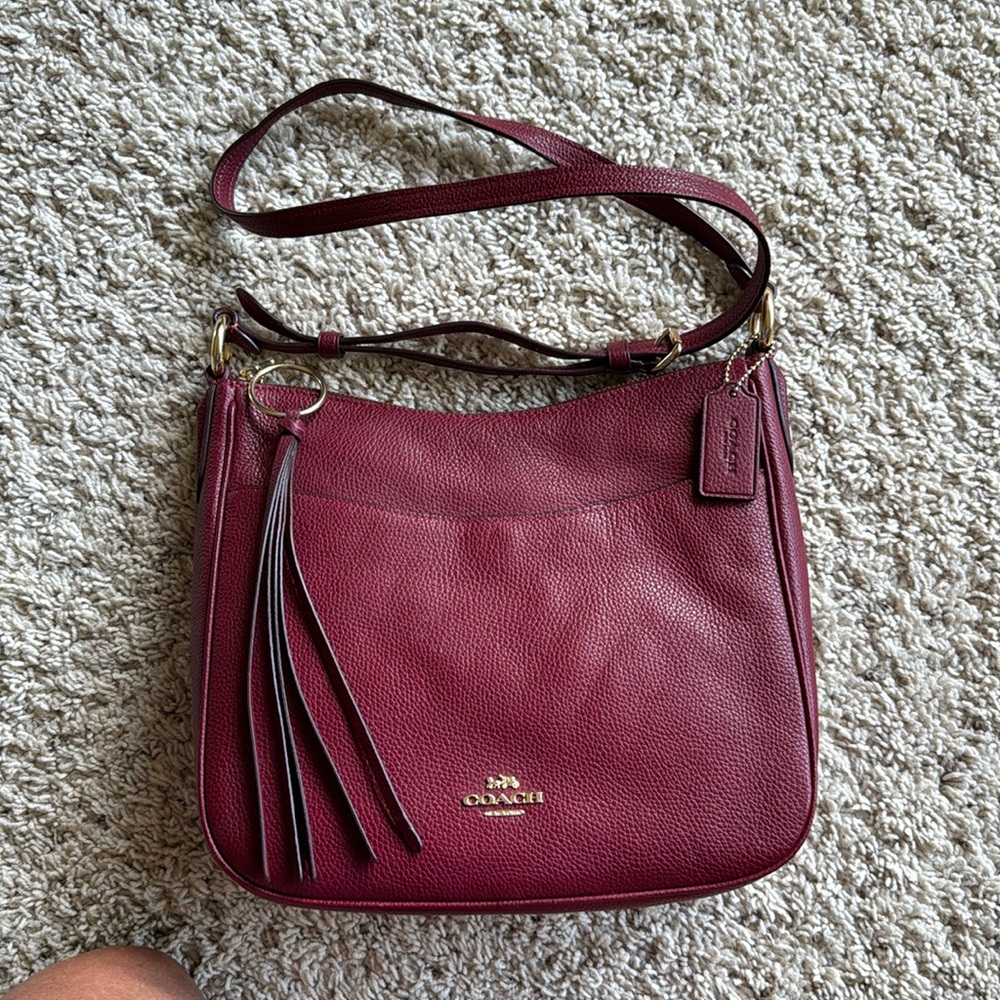 Coach dark red pebble leather shoulder bag.